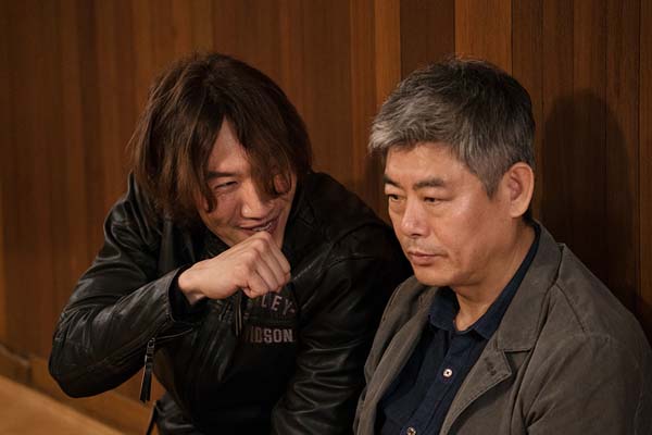 Sung Dong-il et Lee Kwang-soo dans The Accidental Detective 2: In Action (2018)